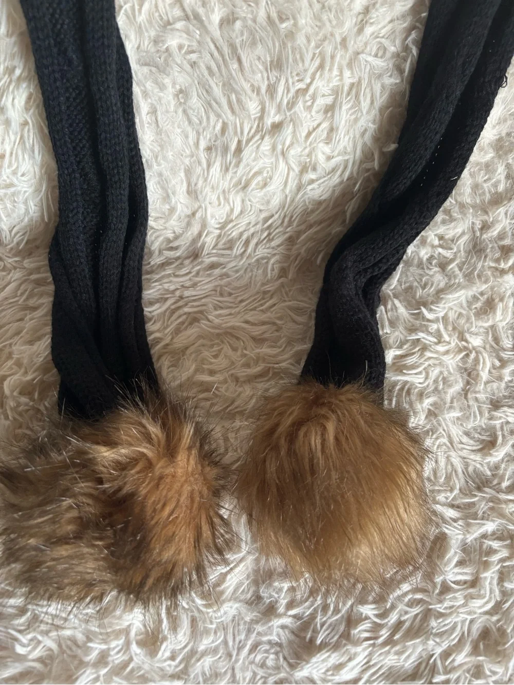Chic Black Knit Scarf with Brown Faux Fur Pom-Poms